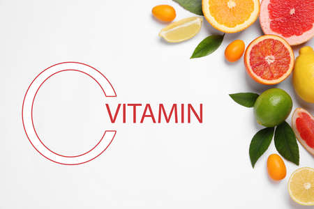 Source of Vitamin C. Fresh juicy citrus fruits with green leaves on light background, flat lay