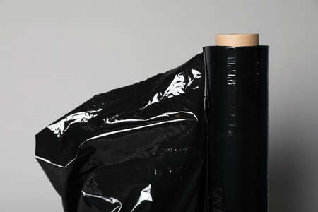 Roll of black stretch wrap on light gray background, closeupの写真素材