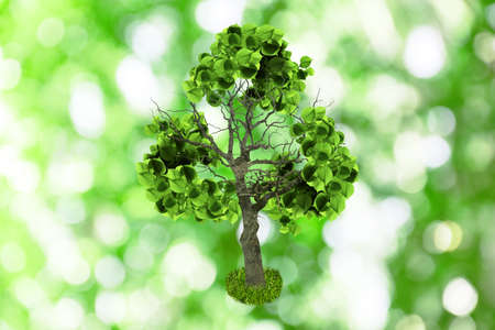 Tree with green leaves in shape of recycling symbol on blurred background. bokeh effectの写真素材