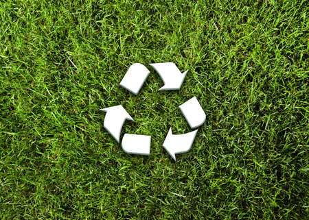 Green grass and illustration of recycling symbol, top viewの写真素材