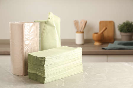 Paper towels on light gray marble table in kitchen. Space for textの写真素材