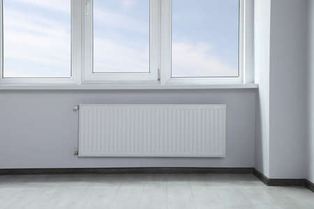 Modern office with window and radiator. interior design