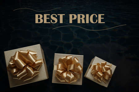 Golden gift boxes and phrase Best Price on black background, flat lay