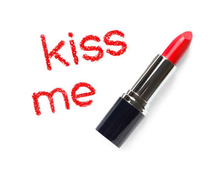 Red lipstick and phrase Kiss Me on white background, top viewの写真素材
