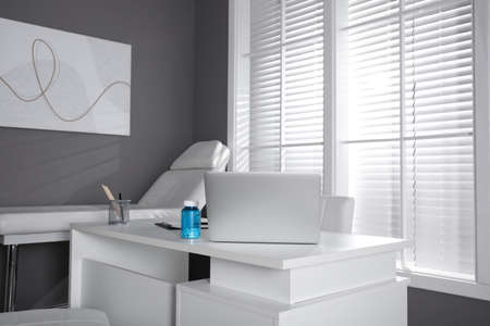 Modern medical office interior with doctor's workplace
