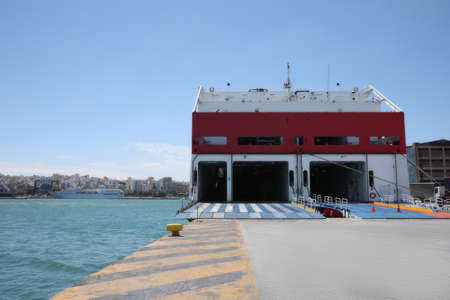 Modern ferry in seaport on sunny day