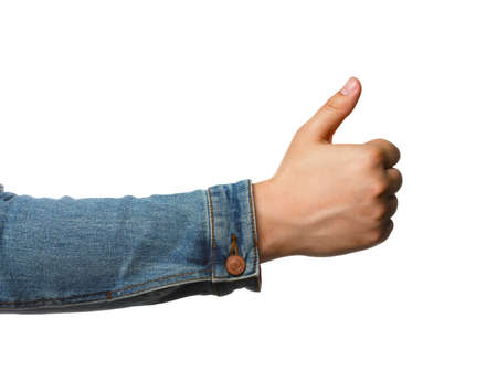 Man showing thumb up on white background, closeup of hand. Hitchhiking gesture