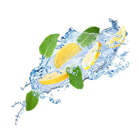 Fresh ripe lemon, mint and splashing water on white backgroundの写真素材