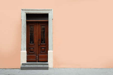 View of building with vintage wooden door, space for text. exterior design