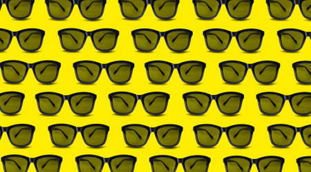 Many stylish sunglasses on yellow background. Seamless pattern designの写真素材