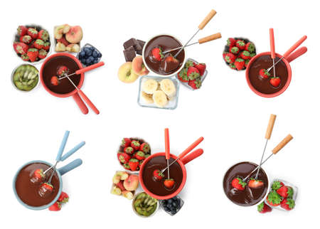 Set with fondue pots with chocolate and fruits on white background, top viewの写真素材