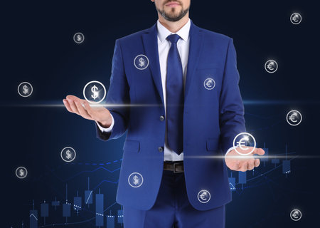 Man demonstrating virtual euro signs on dark background, closeupの写真素材