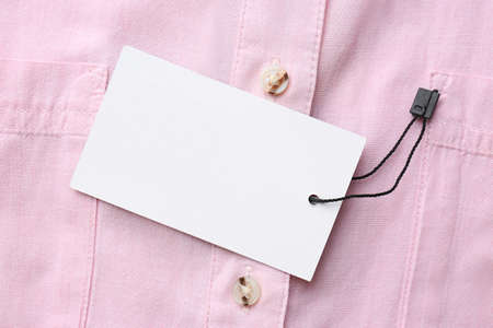 Blank tag on shirt, top view. Space for text