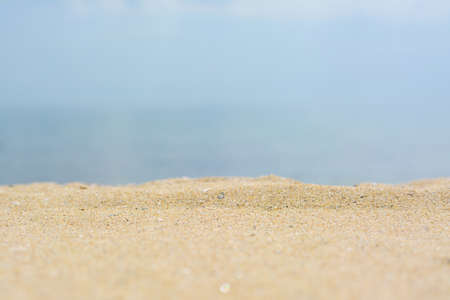 Beautiful beach with golden sand near the sea, closeup view.