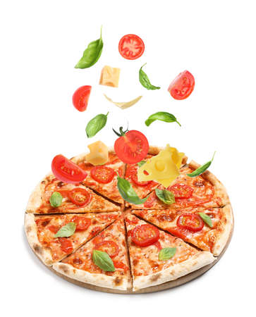 Delicious pizza and flying ingredients on white backgroundの写真素材
