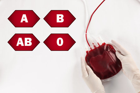 Icons representing different blood types and doctor with blood for transfusion on light gray background, top viewの写真素材