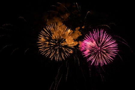 Beautiful bright fireworks lighting up night skyの写真素材