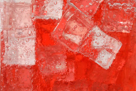 Close up view of cold refreshing drink with ice in glassの写真素材