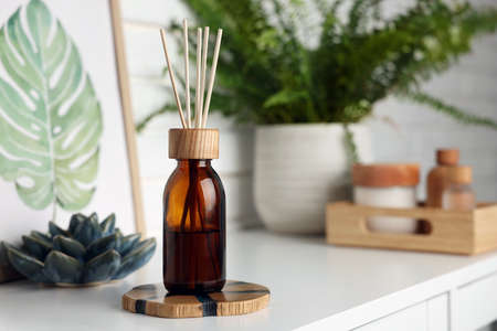 Air reed freshener on white table indoors, space for textの写真素材