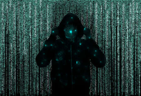 Silhouette of anonymous hacker and digital binary code on dark background. cyber attack concept