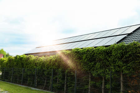 Solar panels installed on house roof outdoors. alternative energy sources