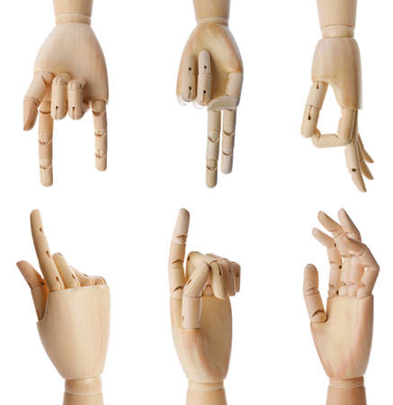 Set with wooden hands of mannequins showing different gestures on white backgroundの写真素材