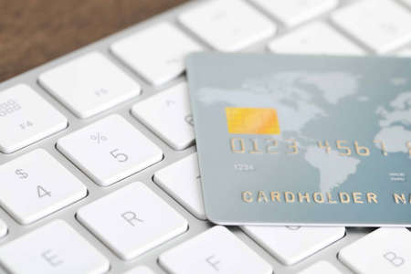 Online payment concept. Bank card on computer keyboard, closeupの写真素材