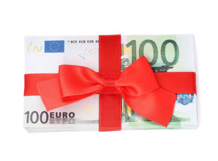 100 Euro banknotes with red ribbon isolated on white, top view. money exchangeの写真素材