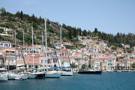 Beautiful view of coastal city with sailboats on sunny day