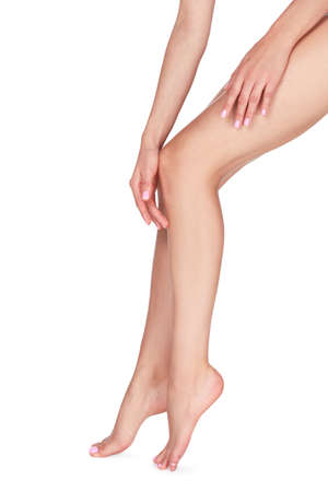 Woman with beautiful long legs on white background, closeupの写真素材