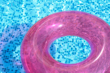 Inflatable ring floating on water in swimming pool, closeupの写真素材