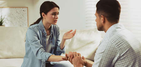 Unhappy young woman having session with her therapist indoors. banner designの写真素材