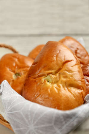 Basket with delicious baked patties, closeup viewの写真素材