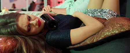 Drunk woman sleeping in messy room after New Year party. banner designの写真素材