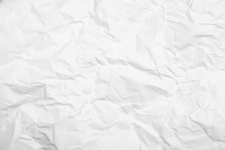 Sheet of white crumpled paper as background, closeupの写真素材