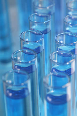 Test tubes with light blue reagents, closeup. laboratory analysis