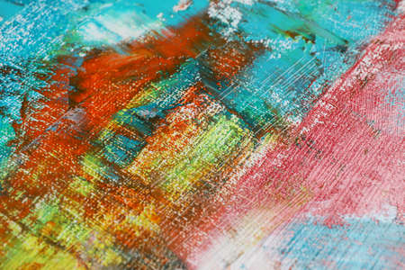 Strokes of colorful acrylic paints on canvas, closeup
