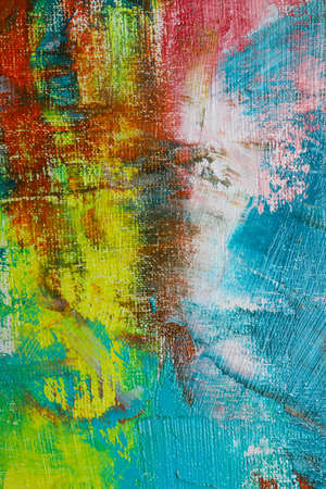 Strokes of colorful acrylic paints on canvas, closeup