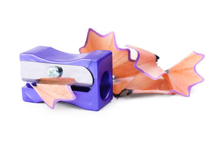 Violet sharpener with pencil shavings on white background