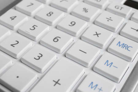 Close up view of white calculator as background