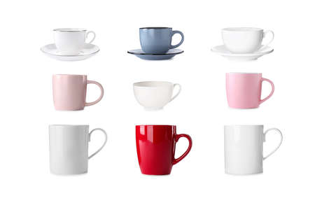 Set with different beautiful cups on white backgroundの写真素材