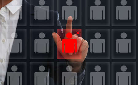 Deciding whether to dismiss employee. Man near virtual screenの写真素材