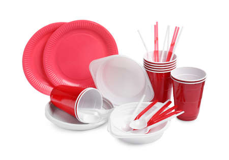 Set of bright disposable tableware on white background