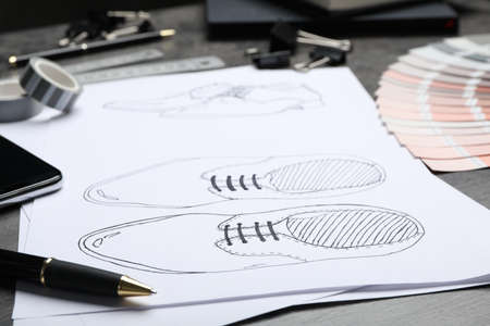 Drawing of shoes on table, closeup. Designer's workplaceの写真素材