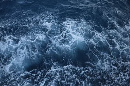 Surface of beautiful sea water with foam as background