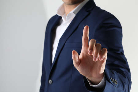 Man scanning fingerprint on light gray background, closeupの写真素材