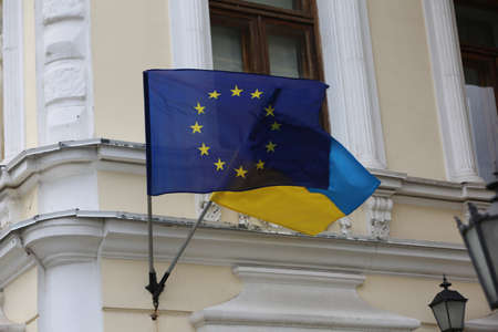 Flags of Ukraine and European Union on building facadeの写真素材