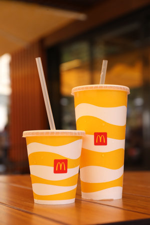 MYKOLAIV, UKRAINE - AUGUST 11, 2021: Cold McDonald's drinks on table in cafeのeditorial素材
