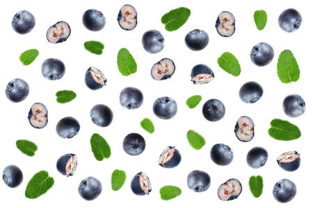Tasty ripe blueberries with green leaves flying on white background