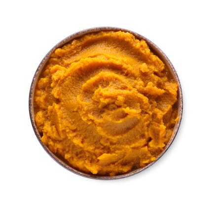 Delicious vegetable puree in bowl isolated on white, top view. healthy foodの写真素材